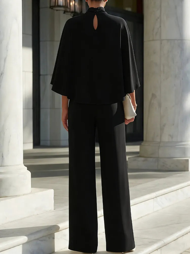 Blouse with cape sleeves and high neckline & wide trousers with slit