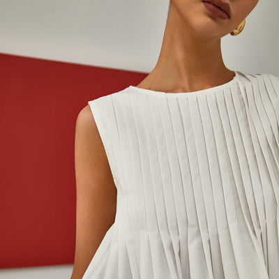 Celia | Bluzka bez rękawów z plisowanym peplum