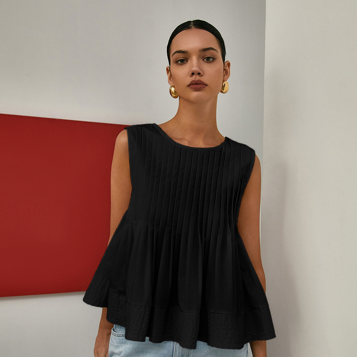 Celia | Bluzka bez rękawów z plisowanym peplum