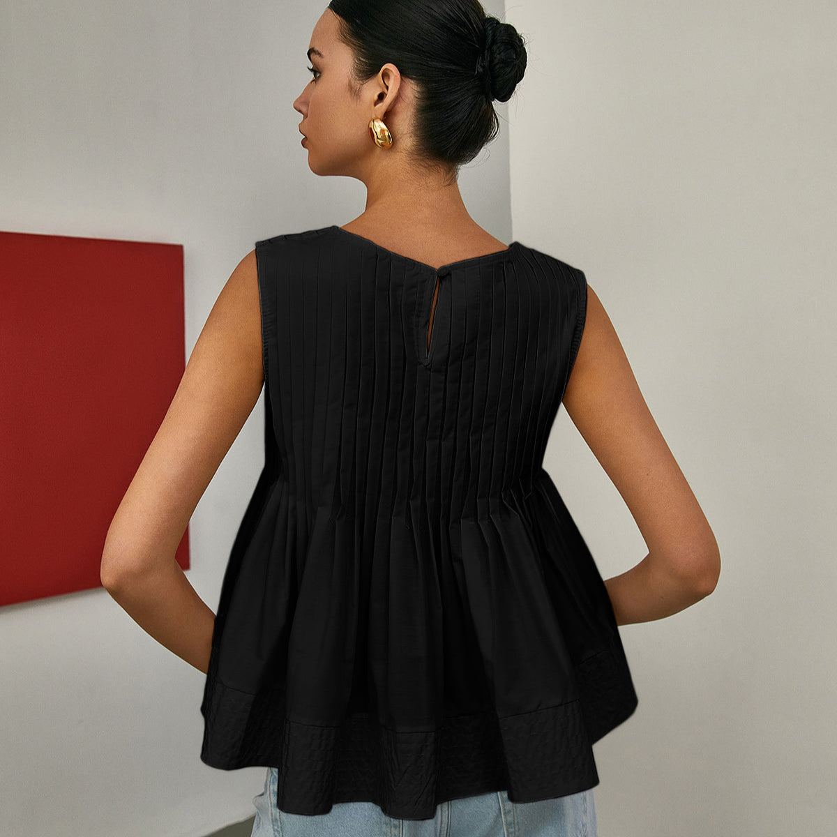 Celia | Bluzka bez rękawów z plisowanym peplum